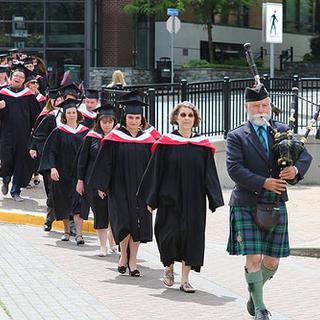 Piper leading students to Port Theatre (Anthropology in front)