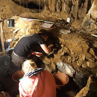 Working inside Scladina Cave, Belgium The two Sarahs are excavating in their units. 