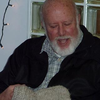 Just what I wanted! Gary is given a Cowichan sweater for his retirement.